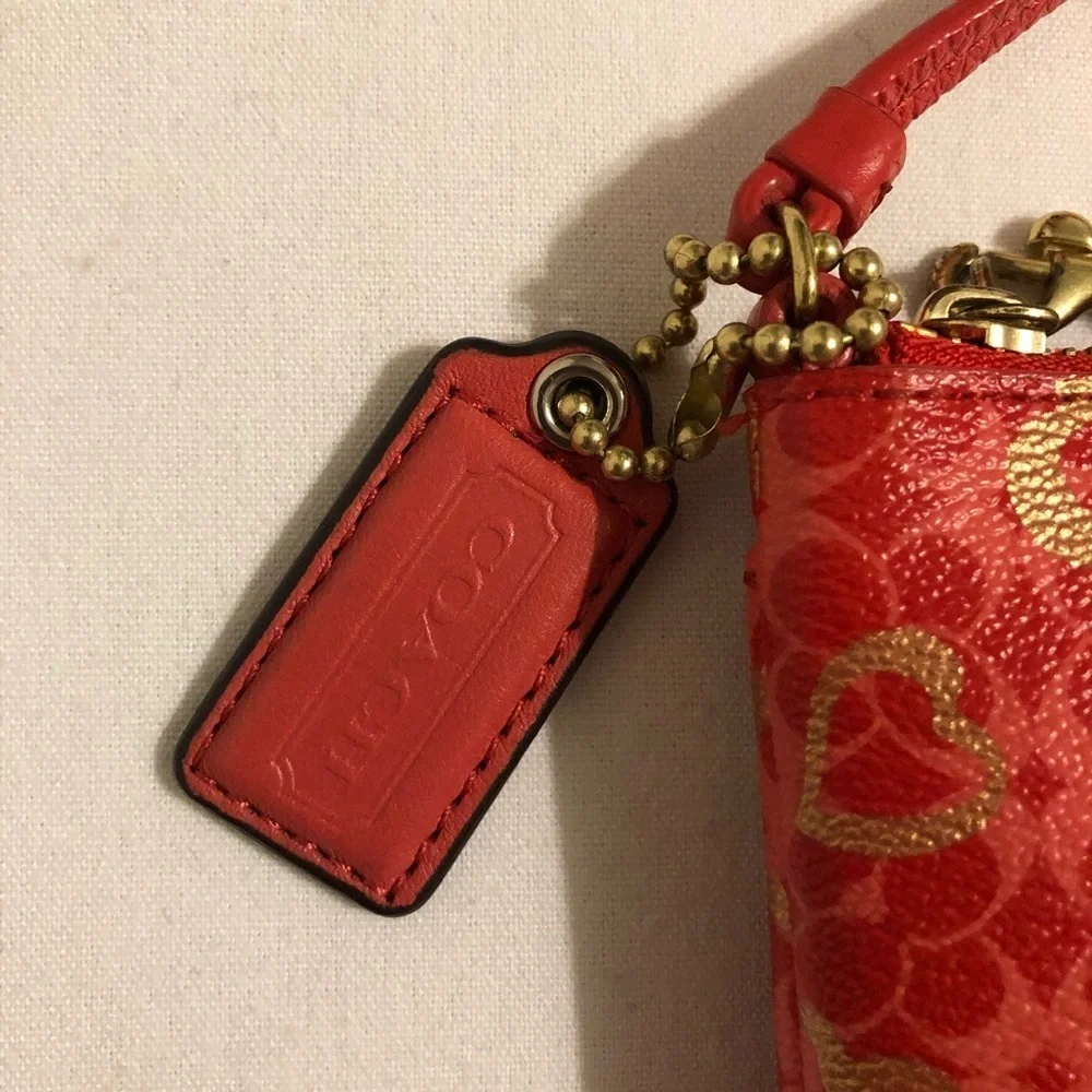 Coach heart wristlet